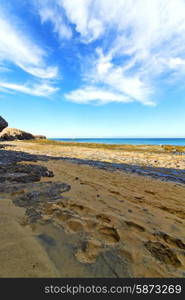 white coast lanzarote in spain beach stone water and summer