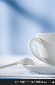 white coffee cup on blue background