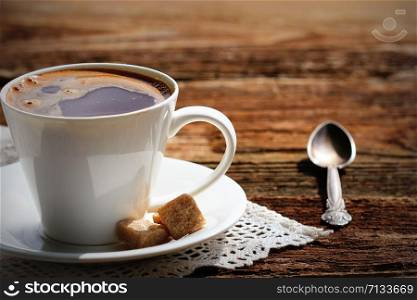 White coffee cup on rustic wood table .. White coffee cup on rustic wood table