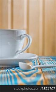 white coffee cup on the old wooden table