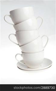 white coffee cups with saucers. Isolated