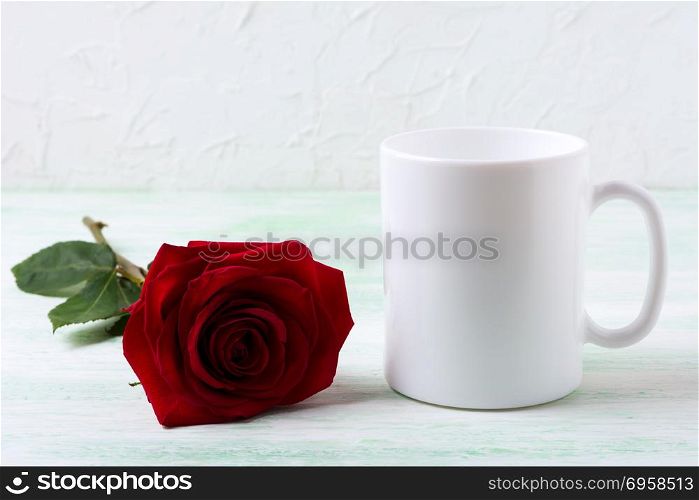 White coffee mug mockup with dark red rose. Empty mug mock up for design presentation.. White coffee mug mockup with dark red rose