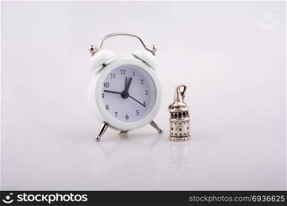 White color alarm clock on white background