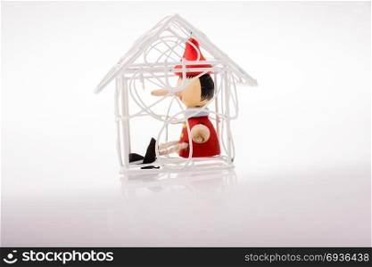 White color model house with pinocchio in