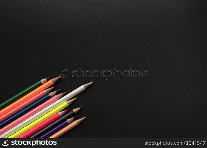 white color pencil lead other share idea on black background wit. white color pencil lead other share idea on black background with copy space