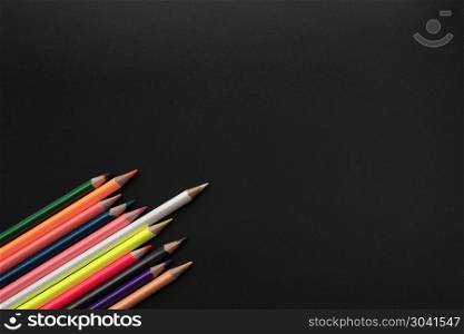 white color pencil lead other share idea on black background wit. white color pencil lead other share idea on black background with copy space