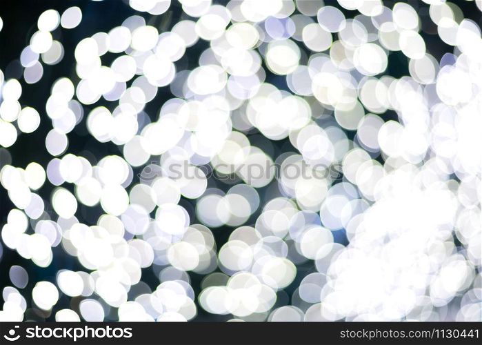 White Colorful light Abstract circular bokeh of Christmas tree background Decoration During Christmas and New Year.