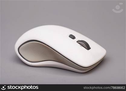 White computer mouse on gray background