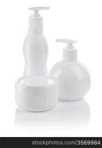 white cosmetical spray bottle and cream