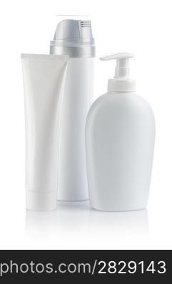 white cosmetical tube and sprays