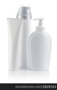 white cosmetical tube and sprays