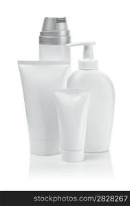 white cosmetical tubes and spray bottles