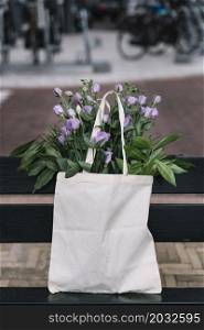 white cotton handbag with beautiful purple eustoma flowers