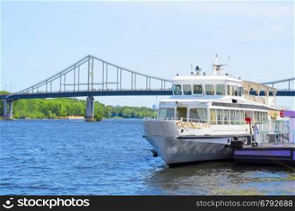 White cruise boat on the river