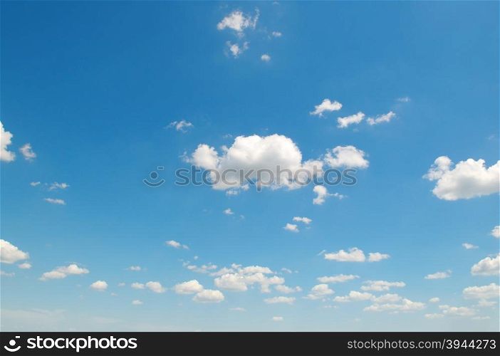 white cumulus clouds against the blue sky
