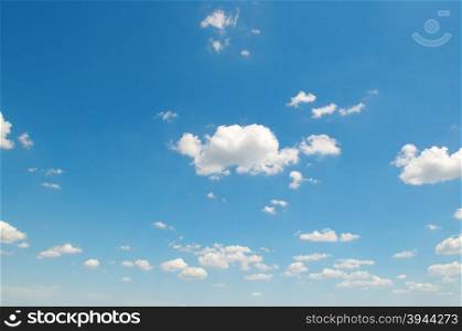 white cumulus clouds against the blue sky