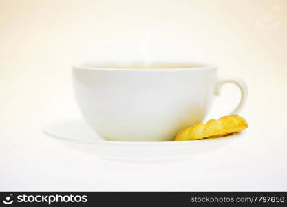 white cup and pastry isolated on white