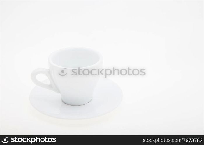 white cup and saucer on a white background