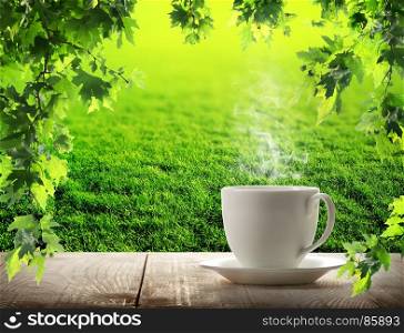White cup coffee and sunny trees background