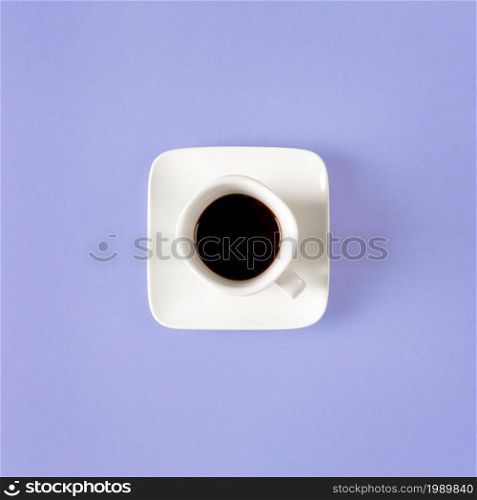 White cup of coffee isolated on a purple background. minimal style. Square composition.. White cup of coffee isolated on a purple background. minimal style. Square composition