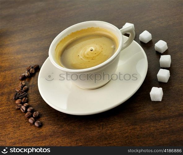 white cup of coffee on a wooden table