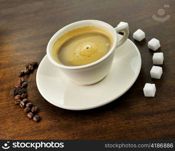 white cup of coffee on a wooden table