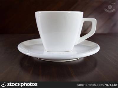 white cup of coffee on table