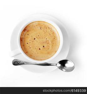 White cup of coffee with spoon on saucer