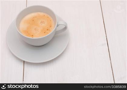 White Cup of Espresso Coffee on Wooden Table