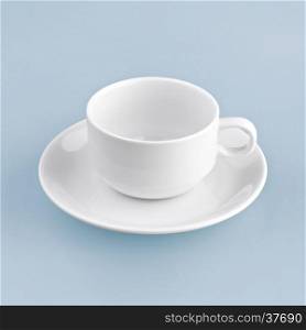 white cup on blue background