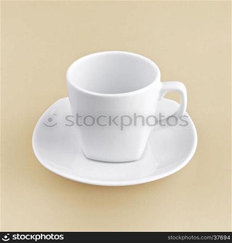 white cup on orange background