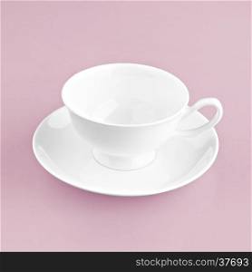 white cup on pink background