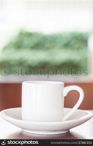 White cup on table in Coffee shop, stock photo