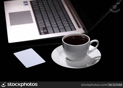 White cup with black coffee at business workplace