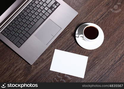 White cup with black coffee at business workplace