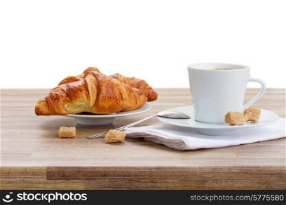 white cup with fresh espresso coffee and croissant. cup of coffee with croissant