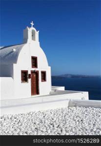 White Cycladic church, blue sky Oia Santorini Greece. Cycladic church Oia Santorini Greece
