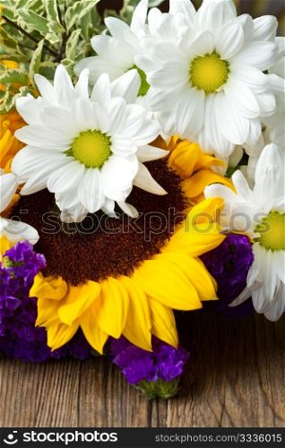 white daisy and yellow sunflower