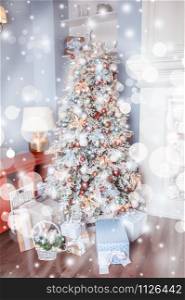 White decorated Christmas tree with many gifts underneath in gentle pastel colors. Good New Year spirit