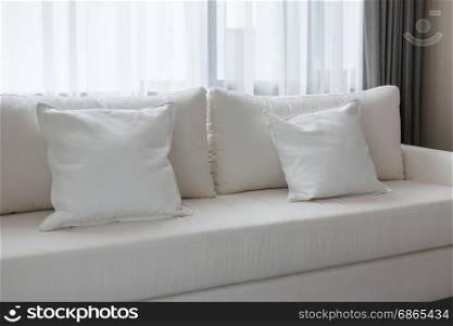 white decorative pillows on a casual sofa in the living room