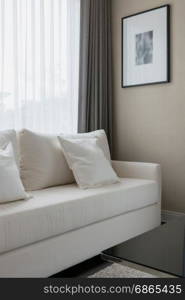 white decorative pillows on a casual sofa in the living room