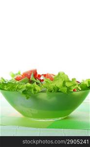 white dish of salad with fresh vegetable on green napkin