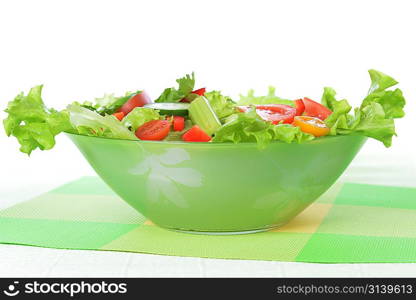 white dish of salad with fresh vegetable on green napkin