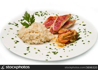 white dish with rice , red mullet fillets and seafood