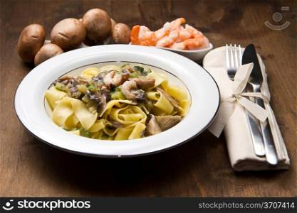 white dish with Shrimp and Mushroom Pasta with fresh ingredients