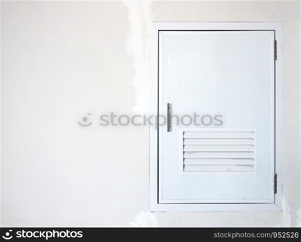 White door of house storage near the garage.