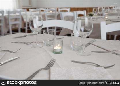White dressed table, close up, horizontal image