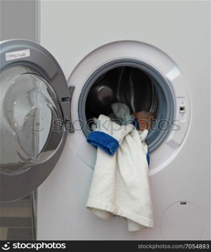 white dressing gown in the washing machine