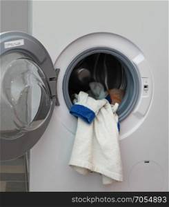 white dressing gown in the washing machine