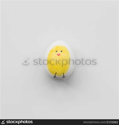 white egg with yellow chicken